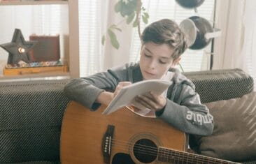 young songwriter with pen and paper