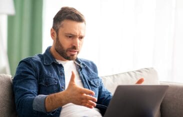 angy man on laptop