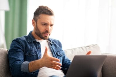 angy man on laptop